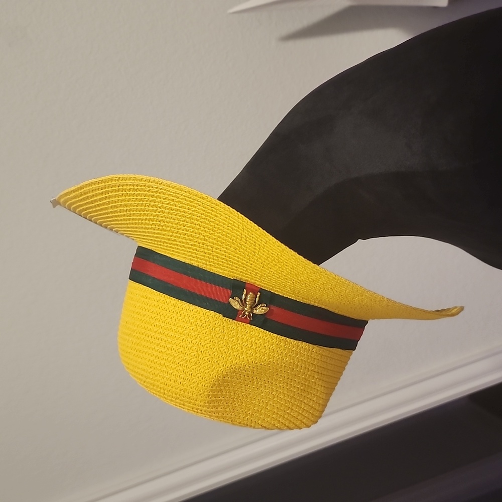 Yellow hat with red and green trim.